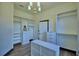 Spacious walk-in closet featuring custom shelving, cabinets and center island at 10708 Belo Horizonte Ave, Clermont, FL 34711