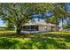Spacious backyard with screened in porch and fenced in area at 1100 Lowry Ave # 63, Lakeland, FL 33801