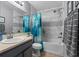 Bathroom featuring tub, shower and updated fixtures at 1100 Lowry Ave # 63, Lakeland, FL 33801