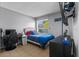 Cozy bedroom featuring natural light, neutral walls, and tile flooring at 1100 Lowry Ave # 63, Lakeland, FL 33801