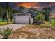 Charming single-story home with a two-car garage and lush landscaping at 1100 Lowry Ave # 63, Lakeland, FL 33801
