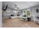The living room has tile flooring and a ceiling fan at 1100 Lowry Ave # 63, Lakeland, FL 33801