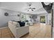 The living room has tile flooring and a ceiling fan at 1100 Lowry Ave # 63, Lakeland, FL 33801
