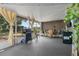 Spacious covered patio with plenty of seating and a grill at 1100 Lowry Ave # 63, Lakeland, FL 33801