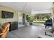 Screened patio with a grill and chair at 1100 Lowry Ave # 63, Lakeland, FL 33801