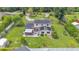 Spacious backyard featuring a covered patio and solar panels, all in a lush green setting at 1125 Rolling Woods Ln, Lakeland, FL 33813