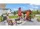 Cozy backyard patio featuring a grill, outdoor seating, and a charming pergola at 1125 Rolling Woods Ln, Lakeland, FL 33813