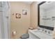 Bathroom featuring tiled floors, large mirror, and a single sink vanity at 1125 Rolling Woods Ln, Lakeland, FL 33813