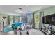 Primary bedroom showcasing natural light, hardwood flooring, and contemporary furnishings at 1125 Rolling Woods Ln, Lakeland, FL 33813