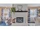 Unique fireplace features an aquarium below the mantle with a heart-shaped mirror above at 1125 Rolling Woods Ln, Lakeland, FL 33813