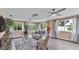 Bright living room with modern decor, plush seating, and large windows with backyard views at 1125 Rolling Woods Ln, Lakeland, FL 33813