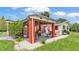 Rear view of a covered outdoor patio with seating area, great for entertaining and relaxing outdoors at 1125 Rolling Woods Ln, Lakeland, FL 33813