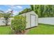 Storage shed in backyard, offering practical storage solutions for tools, equipment, or outdoor furniture at 1125 Rolling Woods Ln, Lakeland, FL 33813