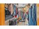 Well-organized walk-in closet features shelving, hanging rods, and ample storage space for clothing and accessories at 1125 Rolling Woods Ln, Lakeland, FL 33813