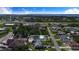 An aerial view of the property highlighting its location within a residential neighborhood near shopping and amenities at 124 Tyler St, Lake Wales, FL 33859