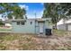 Exterior view of the light blue one story home with a awning covering the front door at 124 Tyler St, Lake Wales, FL 33859