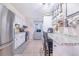 Charming kitchen with stainless steel appliances and a cozy breakfast nook at 124 Tyler St, Lake Wales, FL 33859