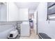 Practical laundry area with a washer, utility sink, and additional storage cabinets at 124 Tyler St, Lake Wales, FL 33859