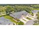 Aerial view of homes featuring well-maintained landscaping and symmetrical design in a serene community setting at 13 Enclave Dr, Winter Haven, FL 33884