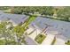 Aerial view of a community featuring well-maintained homes, lush landscaping, and driveway access at 13 Enclave Dr, Winter Haven, FL 33884