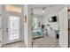 Charming bedroom with tile flooring, a makeup vanity, and a flat screen television at 13 Enclave Dr, Winter Haven, FL 33884