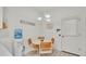A cozy breakfast nook with a charming light fixture next to the front door at 13 Enclave Dr, Winter Haven, FL 33884