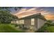 Home featuring well-maintained landscaping, exterior windows, and neutral paint at 13 Enclave Dr, Winter Haven, FL 33884