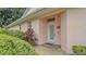 Inviting front entrance with tiled walkway and well-maintained landscaping at 13 Enclave Dr, Winter Haven, FL 33884