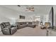 Inviting living room provides a comfortable seating arrangement, an entertainment area, and a dining area at 13 Enclave Dr, Winter Haven, FL 33884
