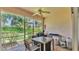 Relaxing screened porch with comfortable seating and a view of the outdoor greenery at 13 Enclave Dr, Winter Haven, FL 33884