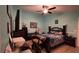 Bedroom with tiled floors, ceiling fan, and desk at 1366 Merrimack Pl, Davenport, FL 33837