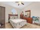 Bedroom featuring a vaulted ceiling, a decorative window, and a dresser for ample storage at 1366 Merrimack Pl, Davenport, FL 33837