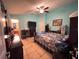 Bedroom with tiled floors, ceiling fan, and desk at 1366 Merrimack Pl, Davenport, FL 33837