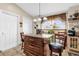 Charming kitchen showcases a central island with barstool seating and plenty of natural light at 1366 Merrimack Pl, Davenport, FL 33837