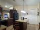 Spacious kitchen with stainless steel appliances, large island, and ample cabinet storage at 1366 Merrimack Pl, Davenport, FL 33837