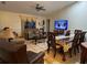 Inviting living and dining areas featuring tile flooring, comfortable seating, and natural light at 1366 Merrimack Pl, Davenport, FL 33837