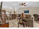 Open-concept living area includes a dining space and comfortable seating, perfect for entertaining at 1366 Merrimack Pl, Davenport, FL 33837