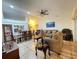 Open-concept living room featuring tile floors, comfortable seating, and a dining area at 1366 Merrimack Pl, Davenport, FL 33837