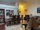 Open-concept living room featuring tile floors, comfortable seating, and a dining area at 1366 Merrimack Pl, Davenport, FL 33837