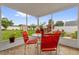 Relaxing screened patio with comfortable seating overlooking a well-maintained backyard at 1366 Merrimack Pl, Davenport, FL 33837