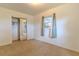 Bright bedroom with neutral carpet, and a closet with mirrored sliding doors at 2125 Hillcrest Rd, Auburndale, FL 33823