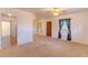 Open living area with neutral carpet, a ceiling fan, and natural light from the window at 2125 Hillcrest Rd, Auburndale, FL 33823
