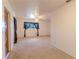 Cozy living room with neutral carpet, a ceiling fan, and a window with decorative curtains at 2125 Hillcrest Rd, Auburndale, FL 33823