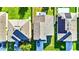 Aerial view of rooftops with solar panels in a well-maintained residential area at 2169 Rose Blvd, Winter Haven, FL 33881