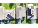 Birds eye view of neighborhood homes with solar panels and manicured green lawns at 2169 Rose Blvd, Winter Haven, FL 33881