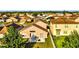View of the backyard and patio featuring a lush green lawn, fencing and residential neighborhood at 2169 Rose Blvd, Winter Haven, FL 33881