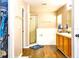 Spacious primary bathroom with a glass-enclosed shower, soaking tub, and wood-look flooring at 2169 Rose Blvd, Winter Haven, FL 33881