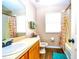 Bright bathroom featuring a white sink, decorative shower curtain, and wood-look flooring at 2169 Rose Blvd, Winter Haven, FL 33881