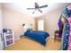 Comfortable bedroom featuring a bed, window, storage, and a ceiling fan at 2169 Rose Blvd, Winter Haven, FL 33881