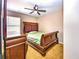 Well-lit bedroom featuring a queen-size bed and wood furnishings, creating a relaxing ambiance at 2169 Rose Blvd, Winter Haven, FL 33881